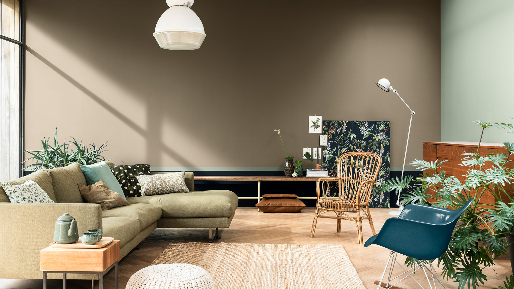 Living room painted in brown and green with green sofa and botanical prints Dulux_CF21_Colour_of_the_year_Earth_colors_global_2