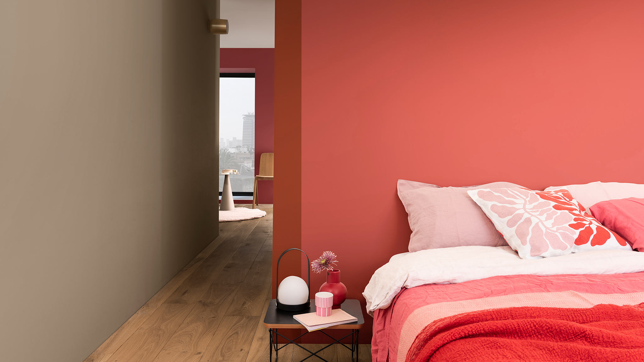 Bed with pink floral cushion against deep pink wall Dulux_CF21_Color_of_2021_Expressive_colors_global_2