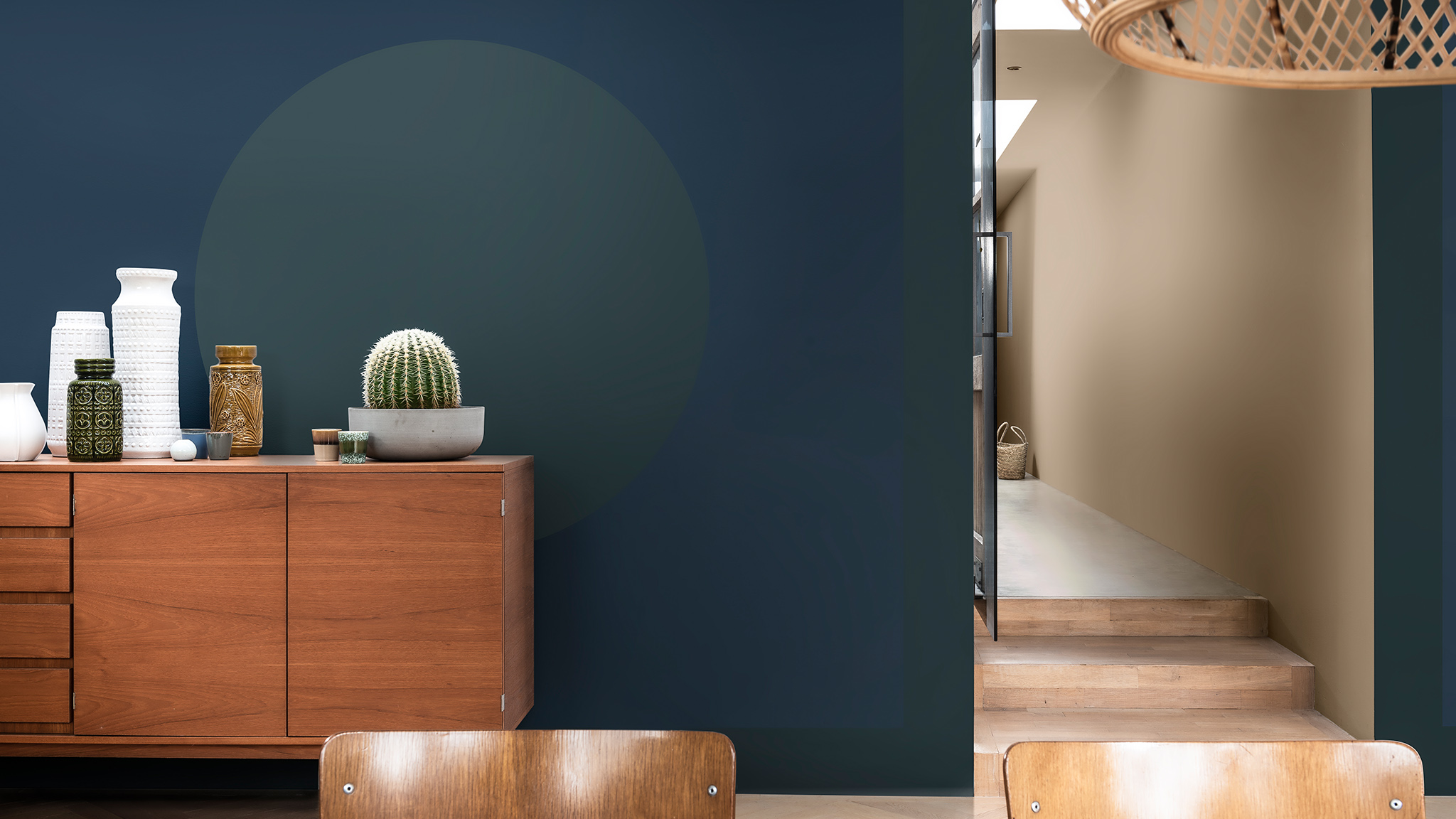 Wooden cabinet against a blue wall with green circle Dulux_CF21_Color_of_2021_Earth_colors_global_4
