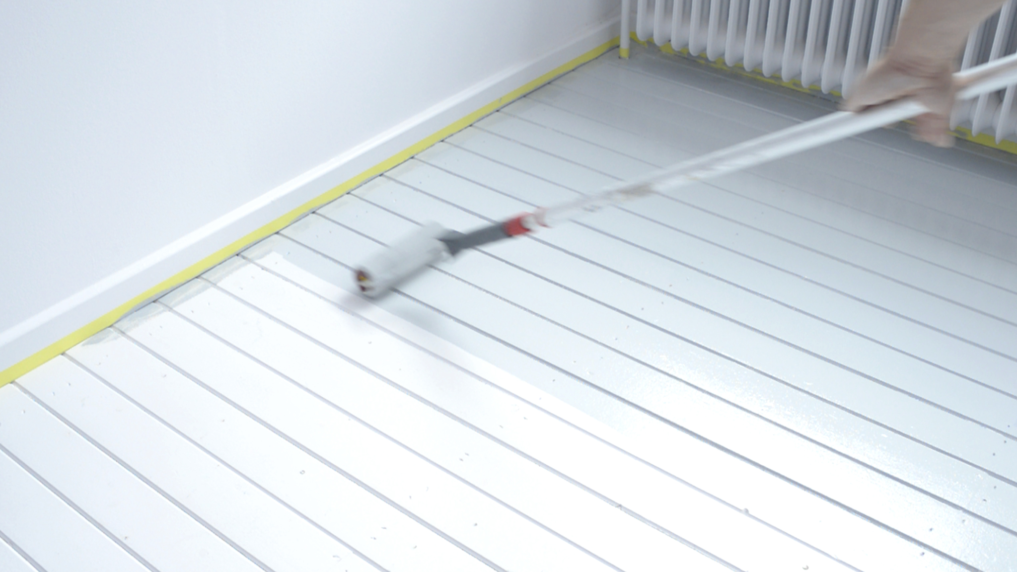 Applying paint to the floor Dulux_painting_wooden_flooring_UK_6
